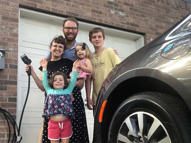 Family with electric car